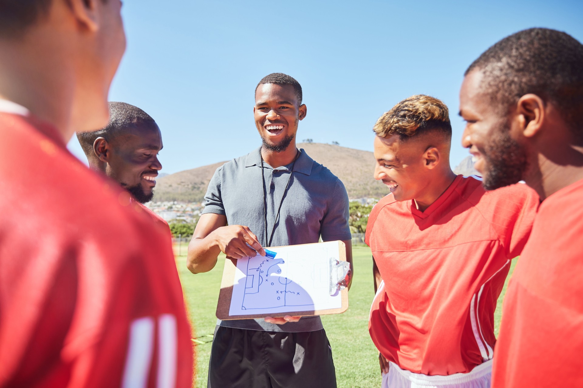 Happy soccer coaching, planning strategy and group training of competition game ideas, vision and formation. Football academy players, sports manager and paper skills, goals and sketch of pitch field